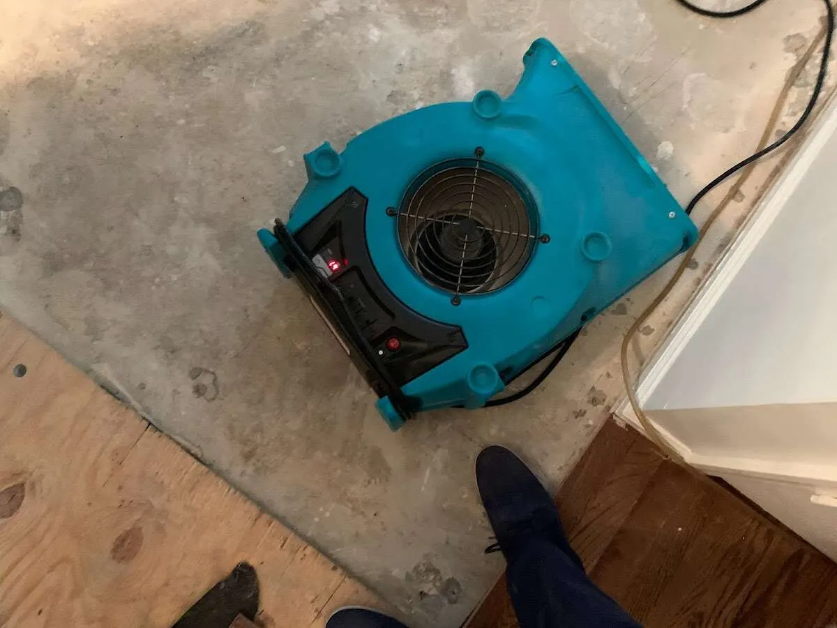 Air mover drying subfloor during Commercial Water Damage Restoration in Wailua Homesteads